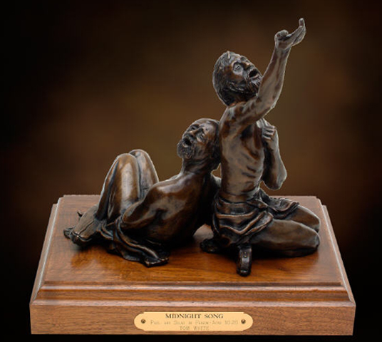 "Midnight Song", tabletop bronze sculpture, Apostle Paul and Silas in prison, Biblical statue, religious bronze statues, Inspirational gifts, Christian artist Tom White, liturgical statues in bronze, monumental church art, sculptures of Old and New Testament characters, monumental religious sculptures, faith-based sculptures, historical religious sculptures