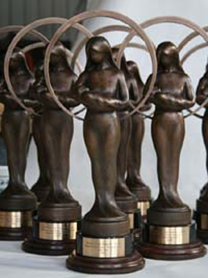 Norinne A. and Raymond E. Ruddy Memorial Life Prizes Award Trophy created by figurative bronze sculptor, Tom White, for Raymond B. and Marilyn A. Ruddy, long-time pro-life philanthropists - an initiative of the Gerard Health Foundation. Statue of a mother cherishing the life of her baby.  Award given to those who do the most to promote the cause of life and against abortion bi-annually in Washington, DC., statue of mother and baby, mother and child sculpture, pro-life award trophy